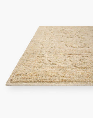 Hand Knotted Wool Rug with a raised texture with organic ivory and natural coloring.