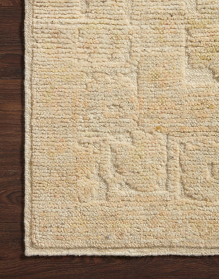 Hand Knotted Wool Rug with a raised texture with organic ivory and natural coloring.
