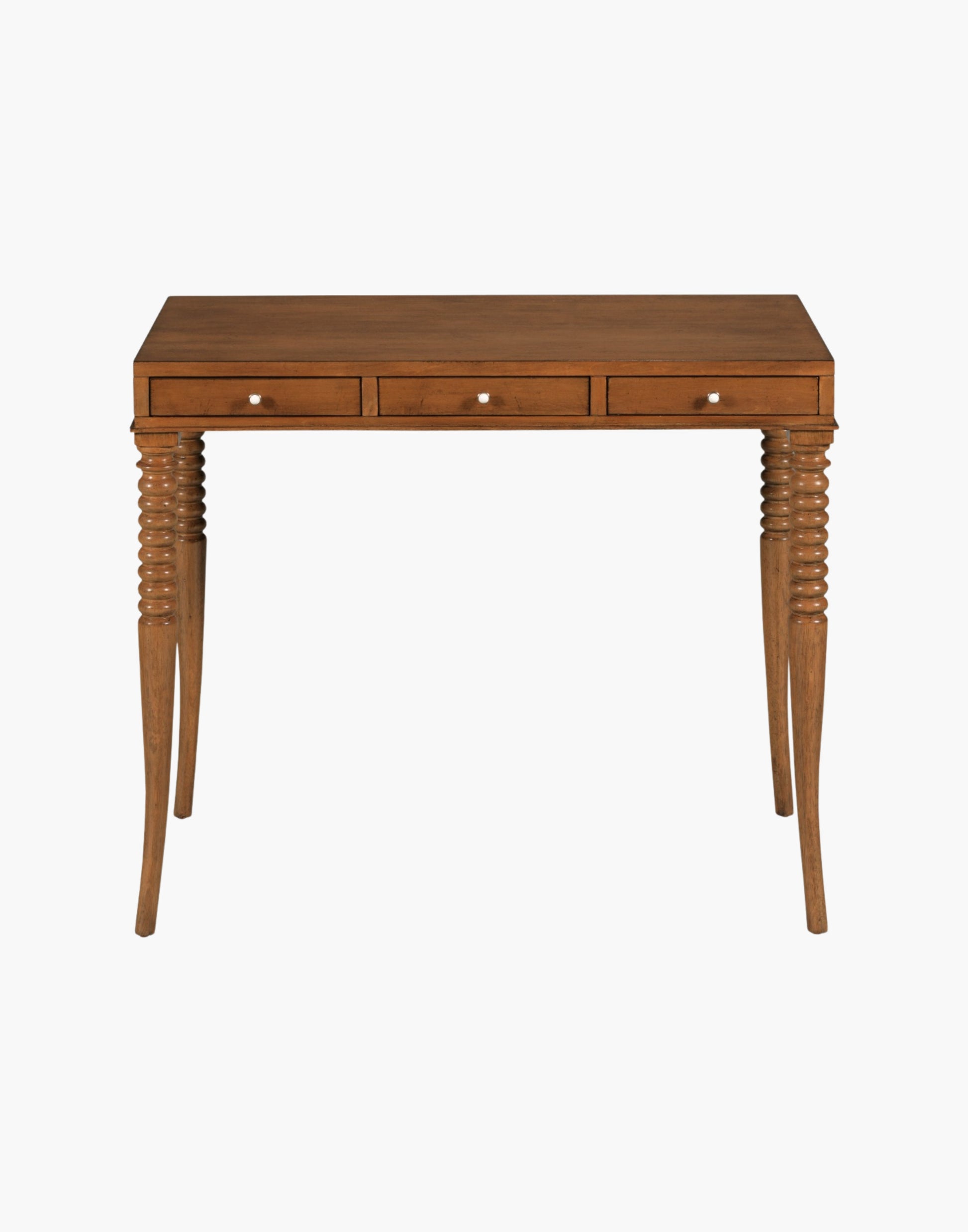 Writing Table Desk in Praline finish with rectangular top, turned flared legs, and three soft-close drawers with brass hardware.