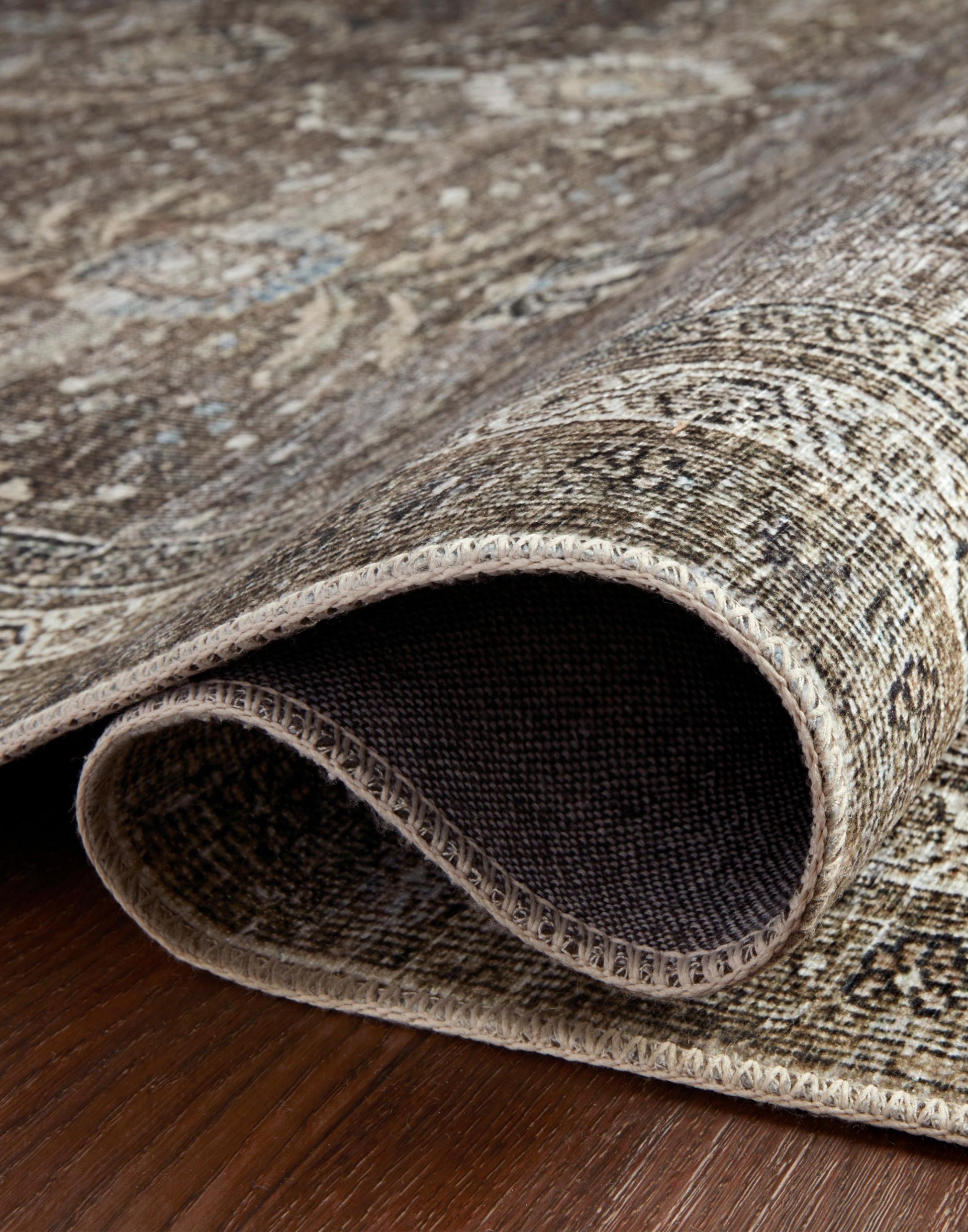 Layla Collection power-loomed polyester rug with classic color palette and subtle patina