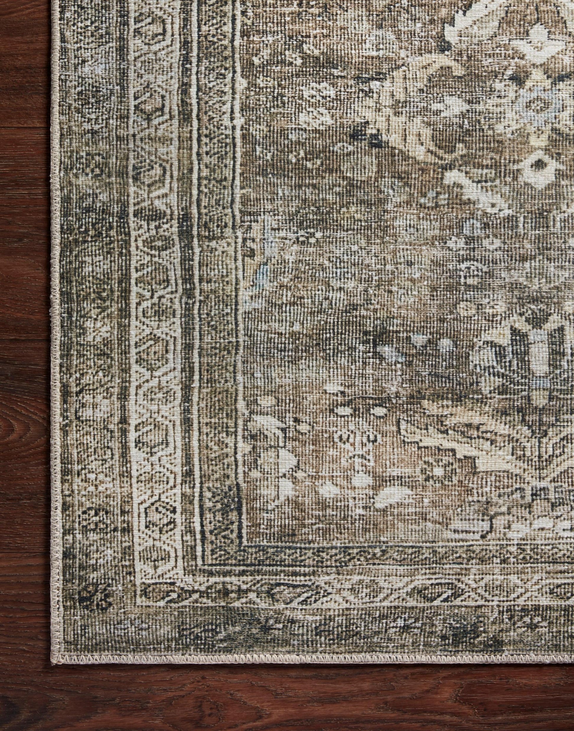 Layla Collection power-loomed polyester rug with classic color palette and subtle patina