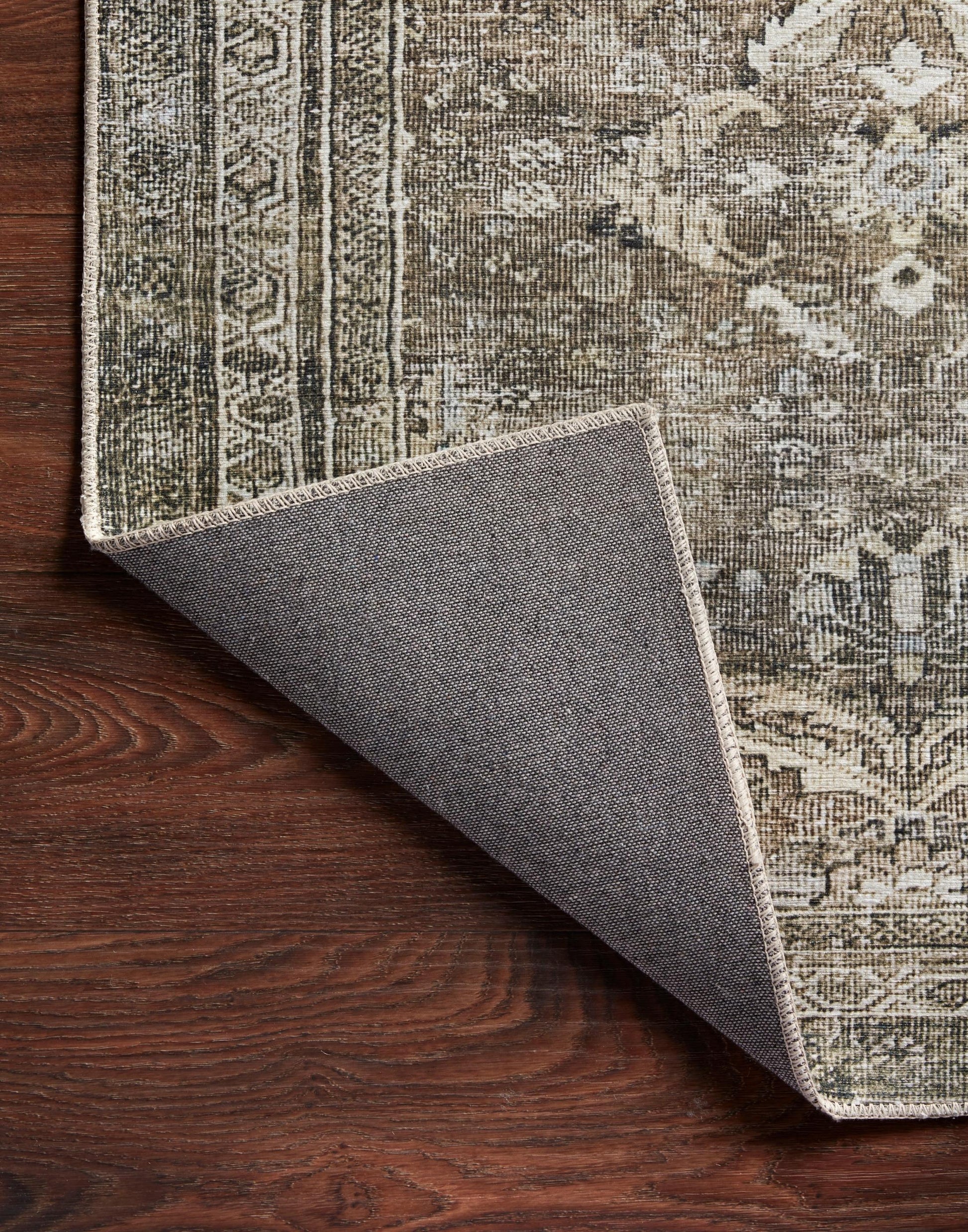 Layla Collection power-loomed polyester rug with classic color palette and subtle patina