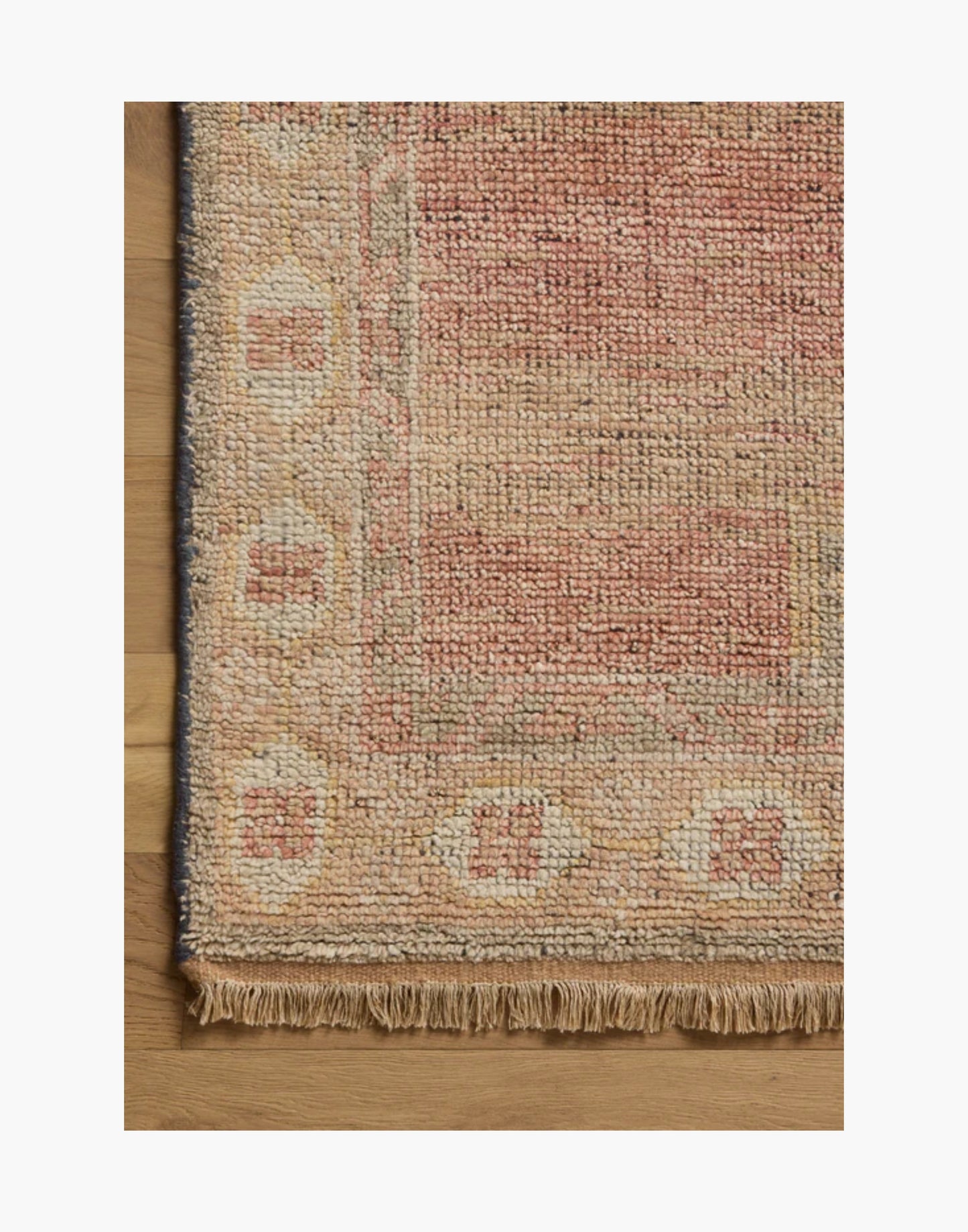 Hand-knotted sunrise and multi-tone area rug with warm earthy colors