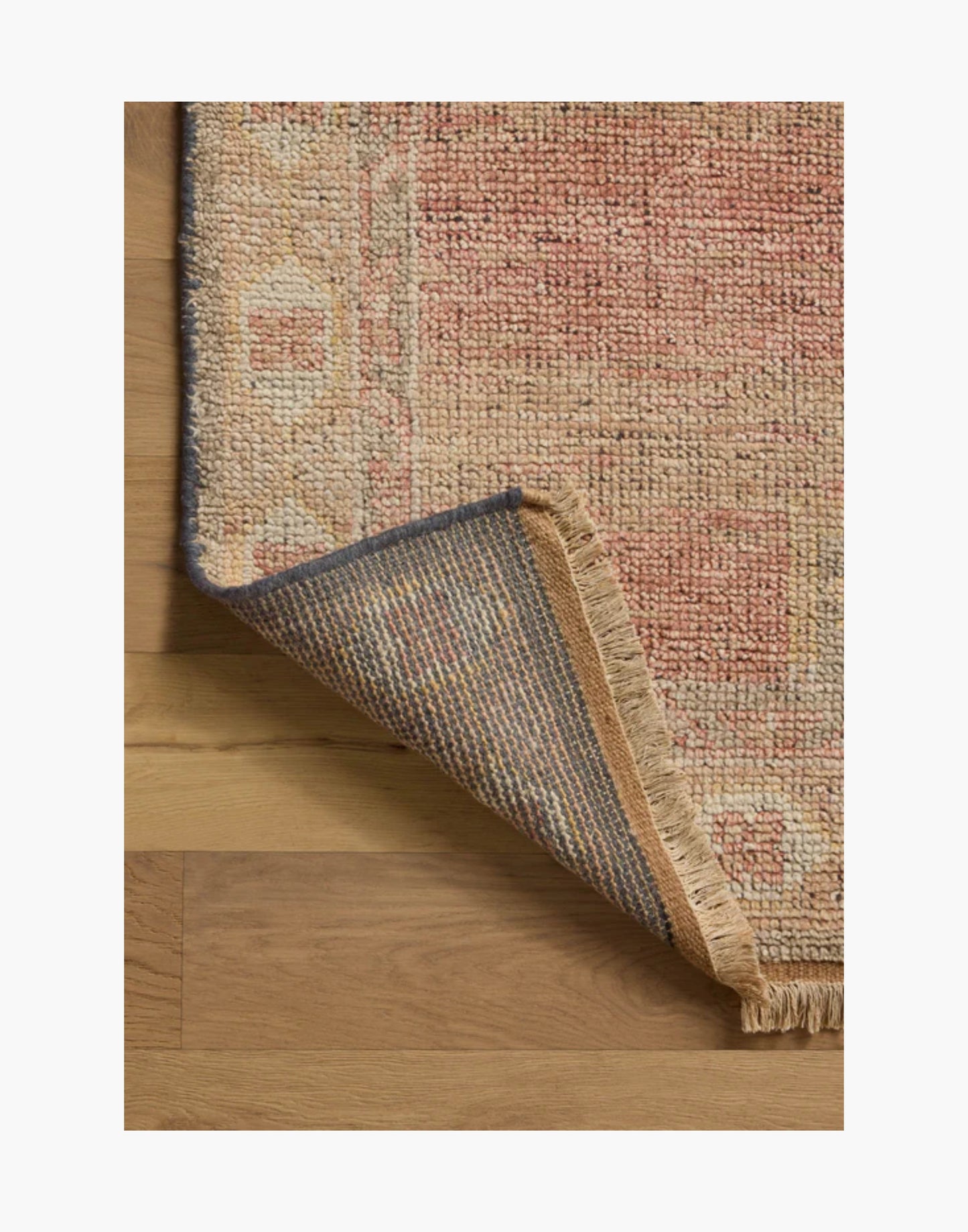 Hand-knotted sunrise and multi-tone area rug with warm earthy colors
