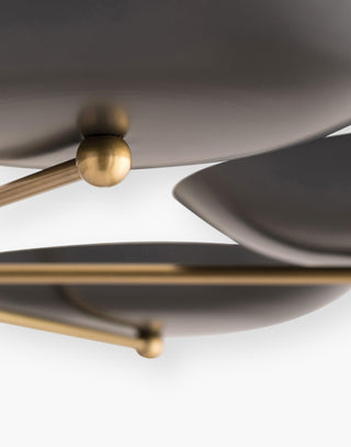 Delicate Bronze and Antique Brass Balance, Upward-Facing Bronze Plates Create Warm Glow.