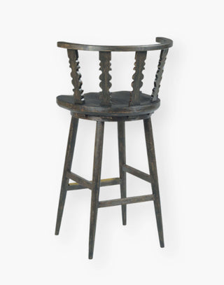 Counter stool with spindle detailing, inspired by 18th-century classics, made from hardwood solids in a warm black finish.