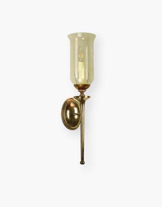 Single wall sconce in solid cast brass with storm glass, elegant brass wall light for mirrors and hallways.