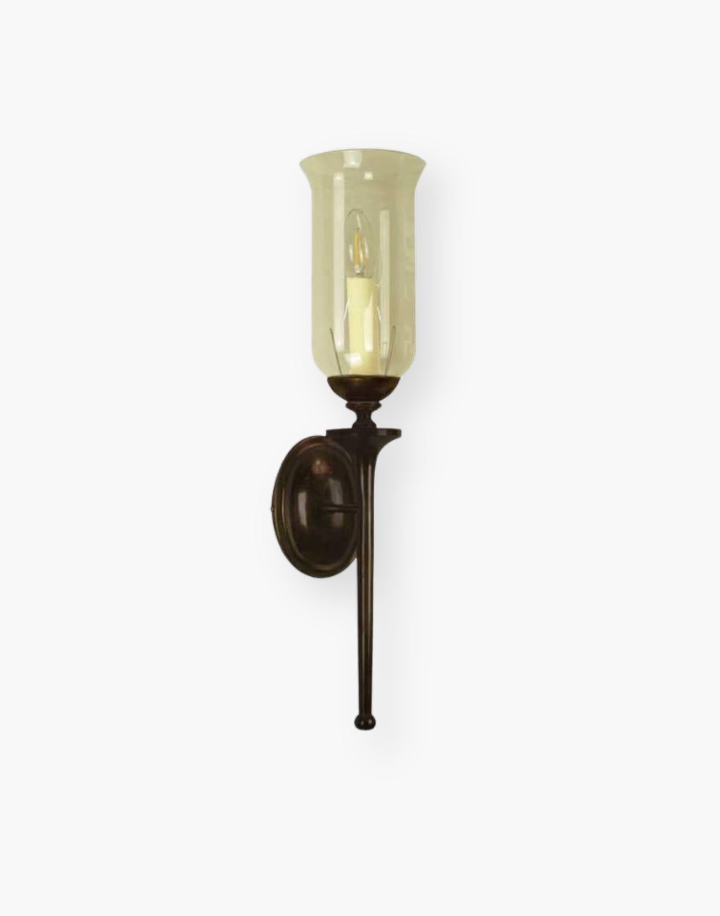Single wall sconce in solid cast brass with storm glass, elegant brass wall light for mirrors and hallways.