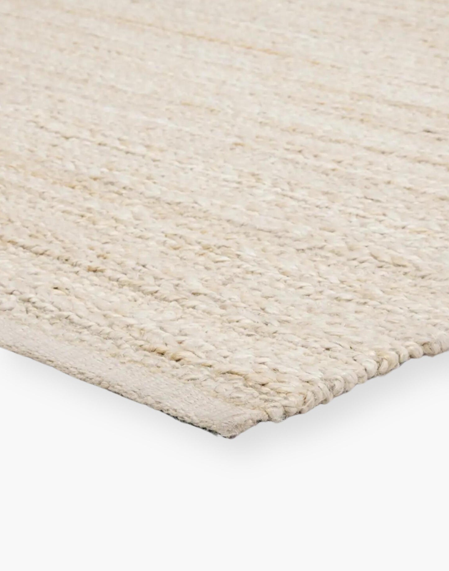 Jute area rug with cotton backing and a rayon blend with creamy natural and bleached white colorway.