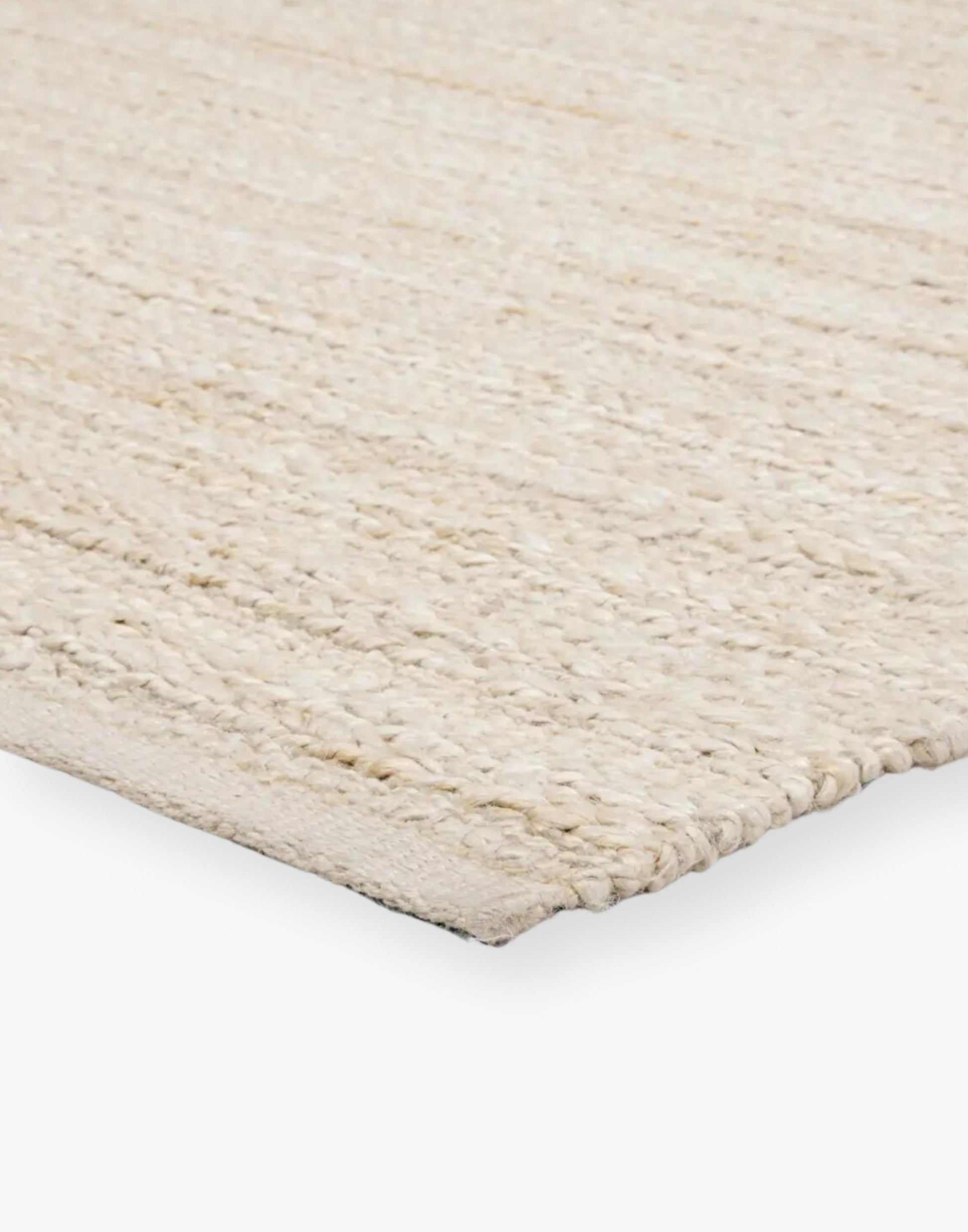 Jute area rug with cotton backing and a rayon blend with creamy natural and bleached white colorway.