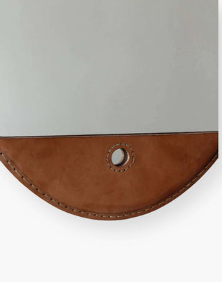 Hand-stitched, vegetable-tanned leather mirror.
