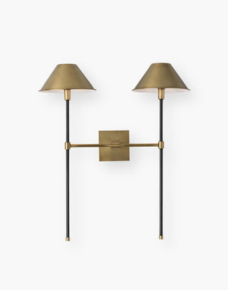 Sconce with dual shades and pipes with antique brass finish.
