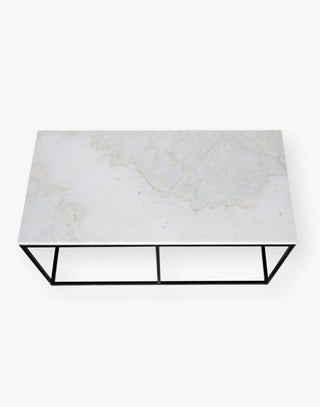 rectangle coffee table with quartz top supported by black simple metal frame