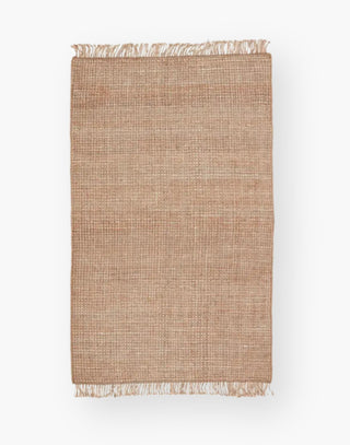 Jute rug with a texture-rich chunky weave, with a casually elegant layer lends an earthy accent in a duo-toned ivory and beige colorway with a knotted fringe.