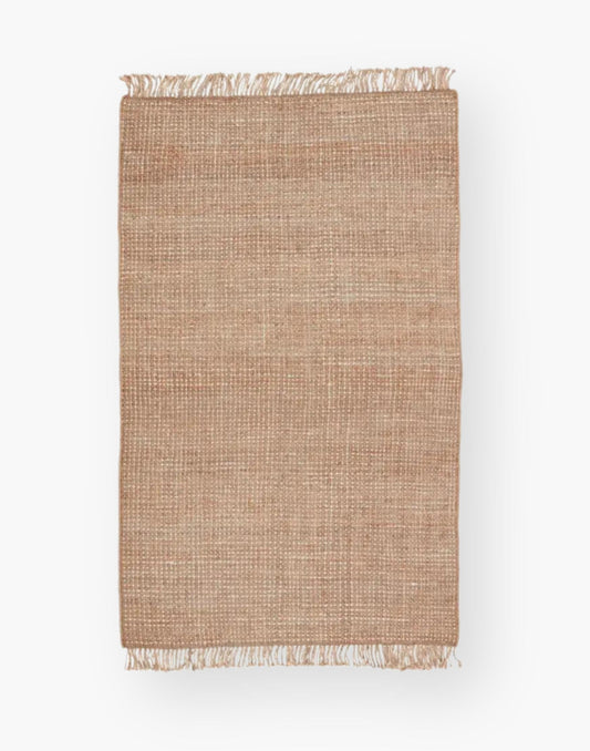 Jute rug with a texture-rich chunky weave, with a casually elegant layer lends an earthy accent in a duo-toned ivory and beige colorway with a knotted fringe.