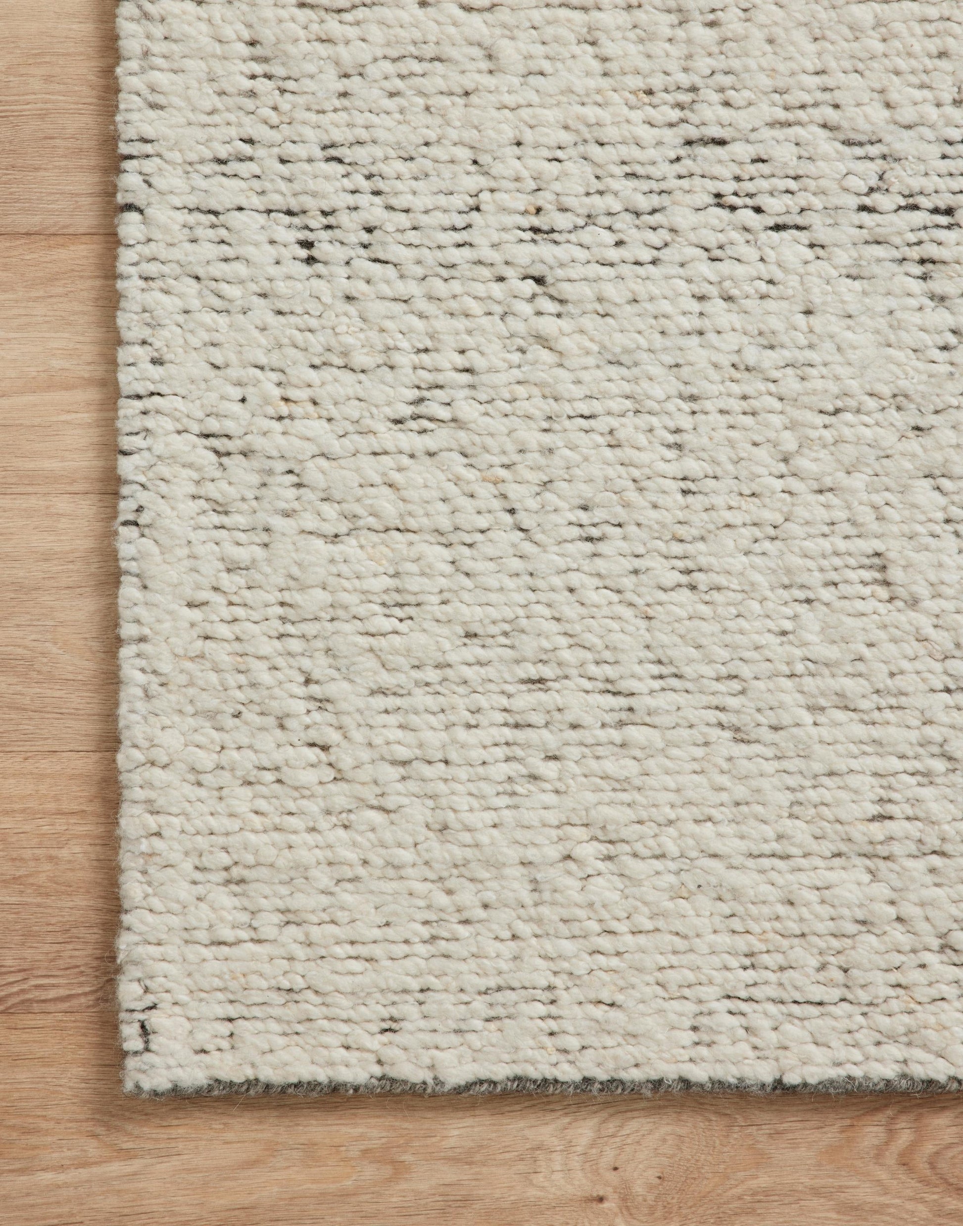 Hand Knotted Rug with Silver and Natural Colors.