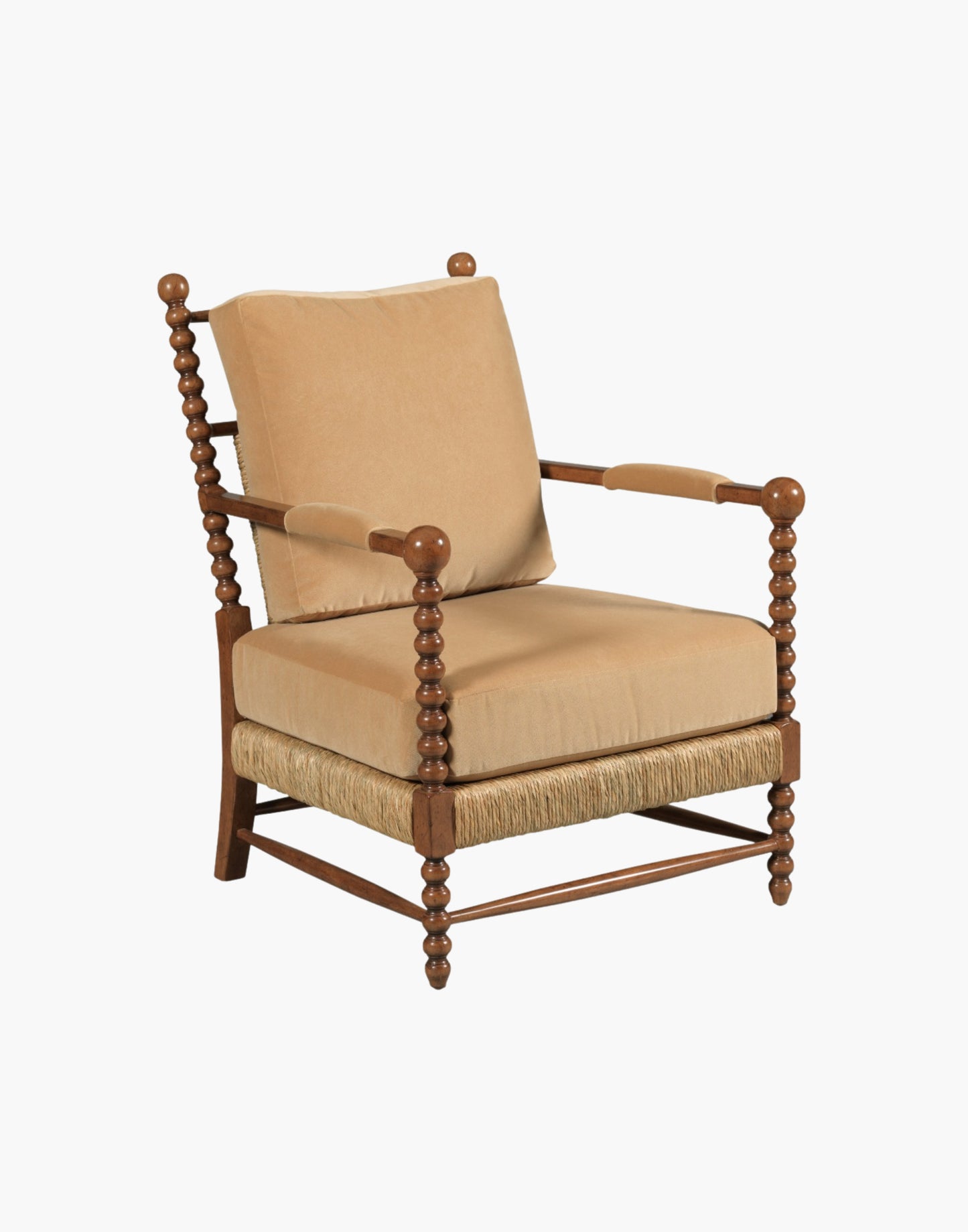 Lounge Chair with bobbin-turned posts, loose upholstered cushions over woven rush seat and back, paddle arms with padded upholstery, hardwood solids, finished in Praline with Banks Caramel Velvet upholstery.