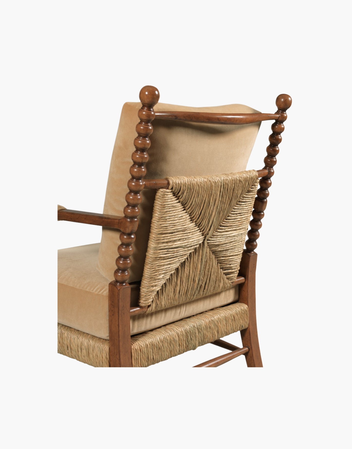 Lounge Chair with bobbin-turned posts, loose upholstered cushions over woven rush seat and back, paddle arms with padded upholstery, hardwood solids, finished in Praline with Banks Caramel Velvet upholstery.