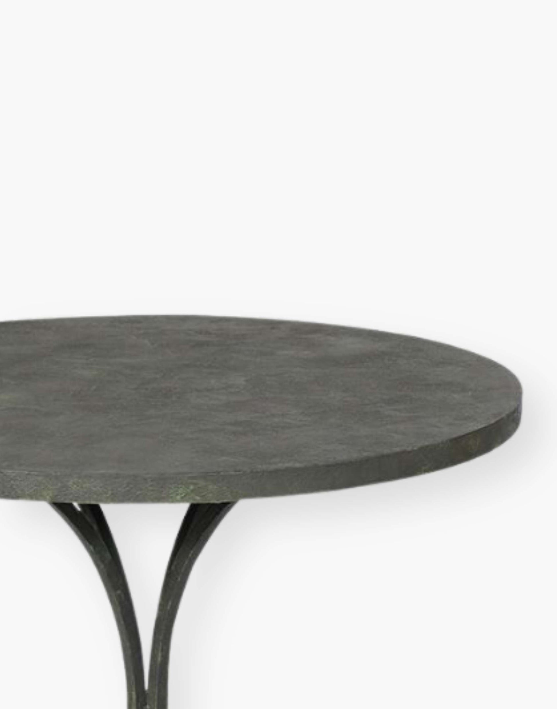 18th century French inspired guéridon with a honed metal top over four shaped metal legs.