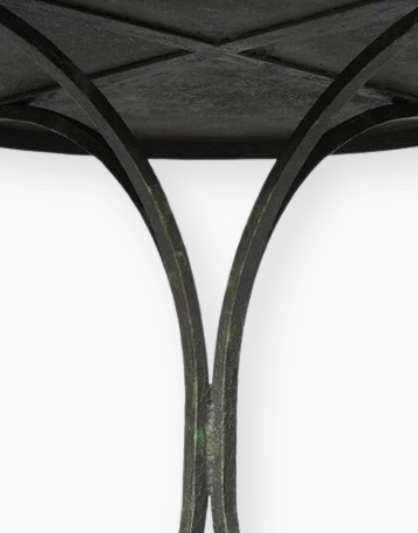 18th century French inspired guéridon with a honed metal top over four shaped metal legs.