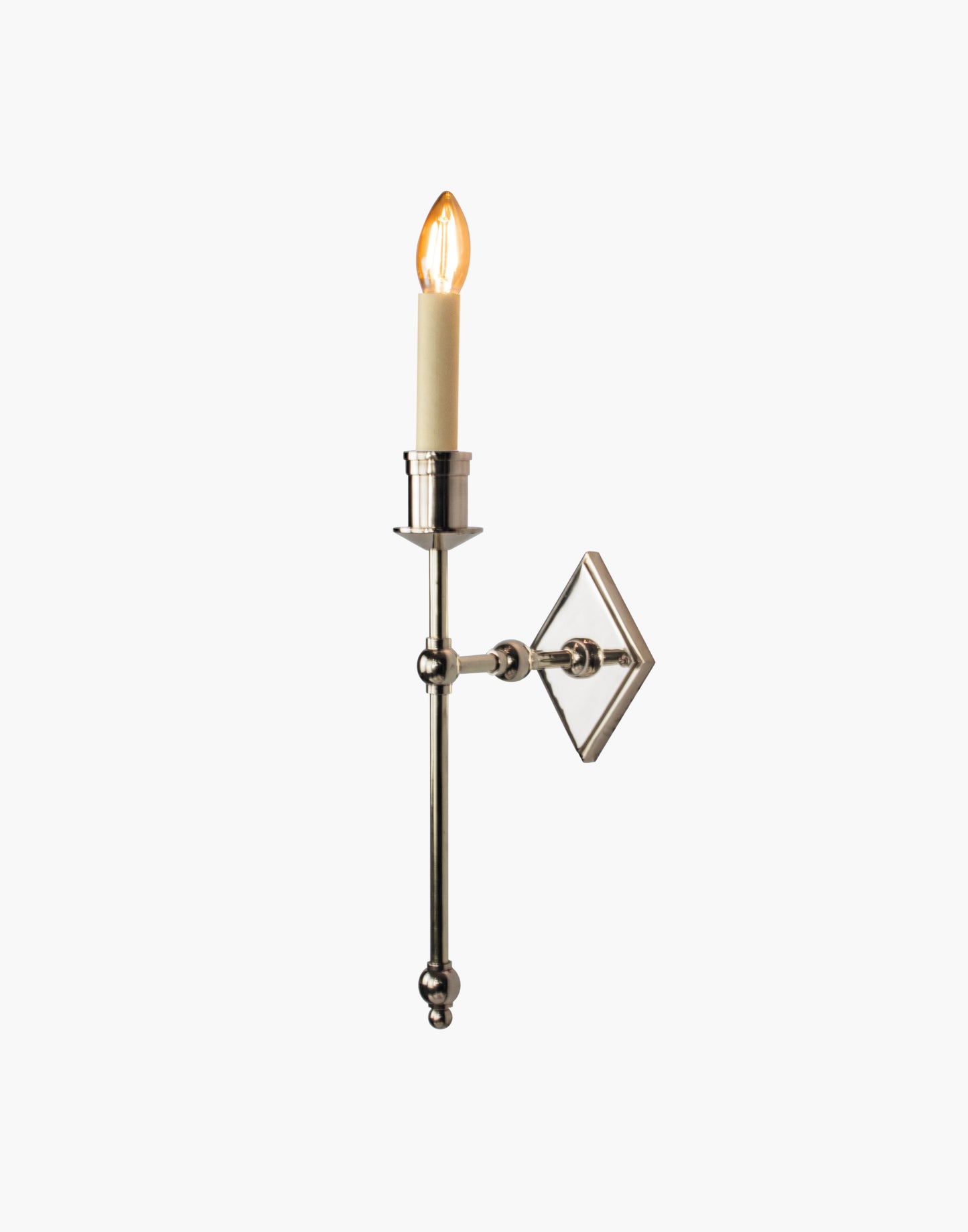 Wall sconce in cast and machined brass with diamond-shaped scalloped backplate and optional shade.