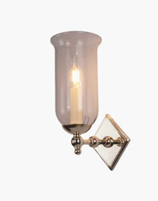 Christina Storm Glass Wall Sconce in solid brass with diamond-shaped backplate and scalloped edge. Rustic yet elegant, suits traditional and contemporary interiors.