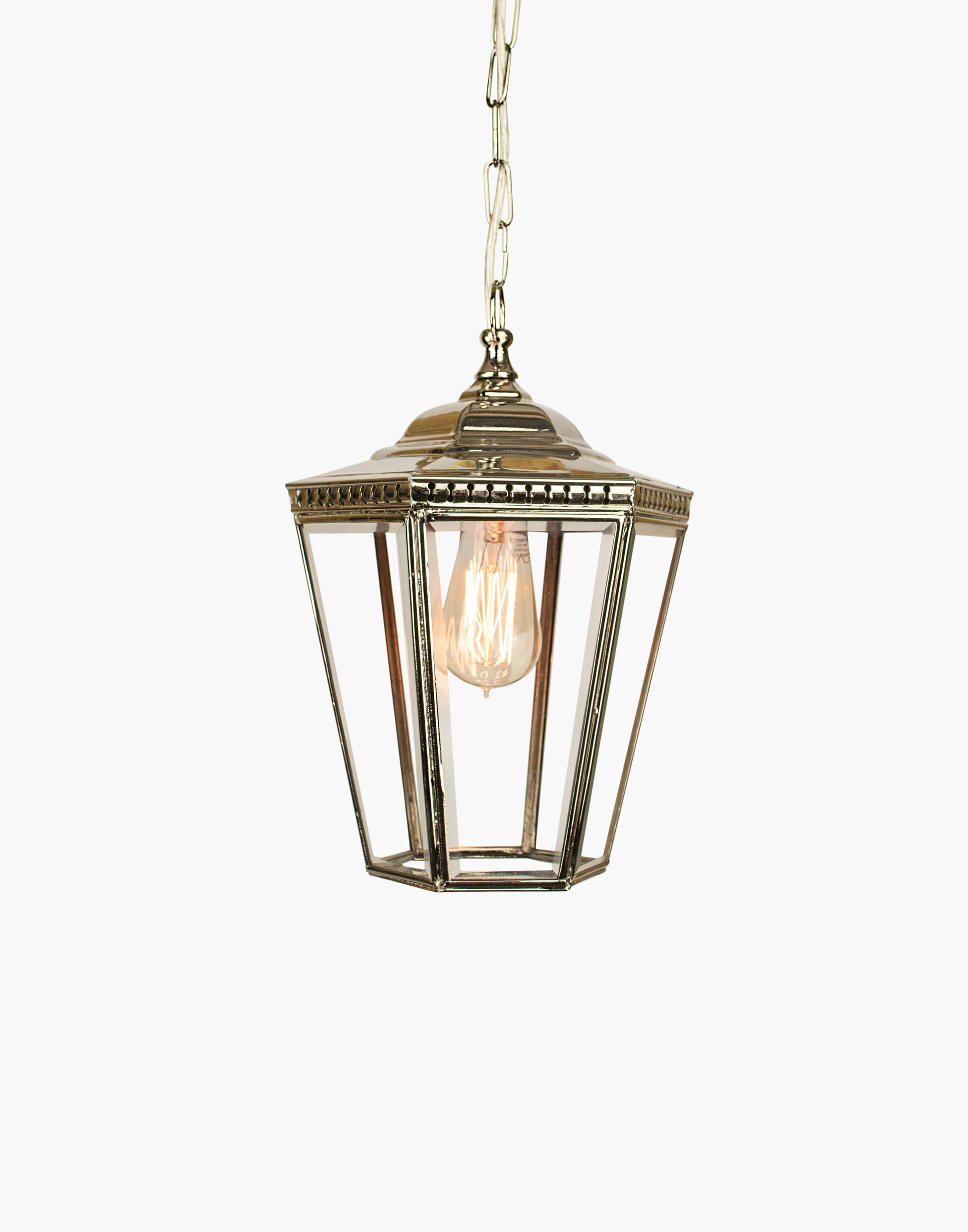 Pendant lantern in solid copper with pierced brass fretwork, beveled glass, finial and chain, suitable for damp locations.