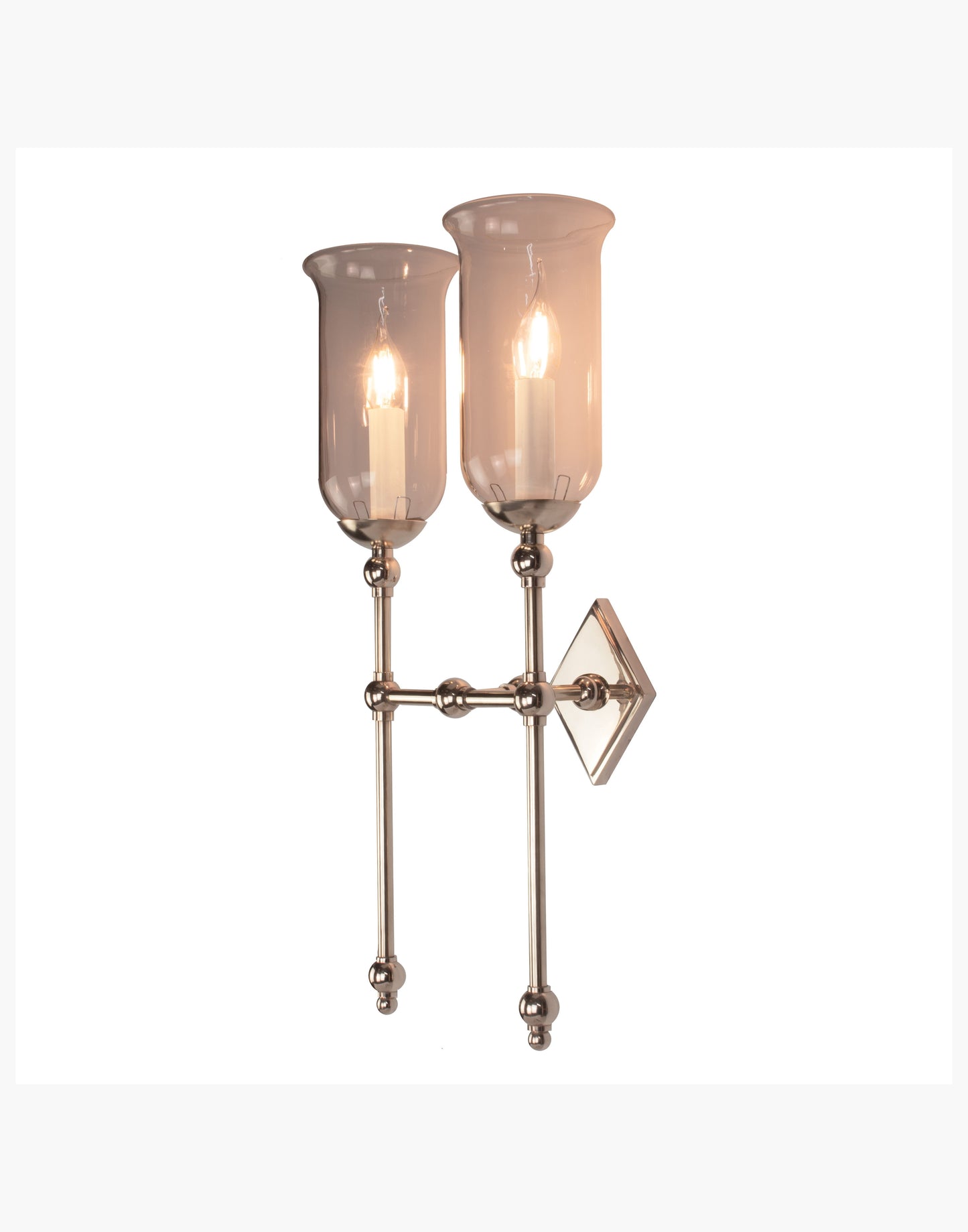 Tall Storm Glass twin wall sconce with diamond-shaped brass back plate