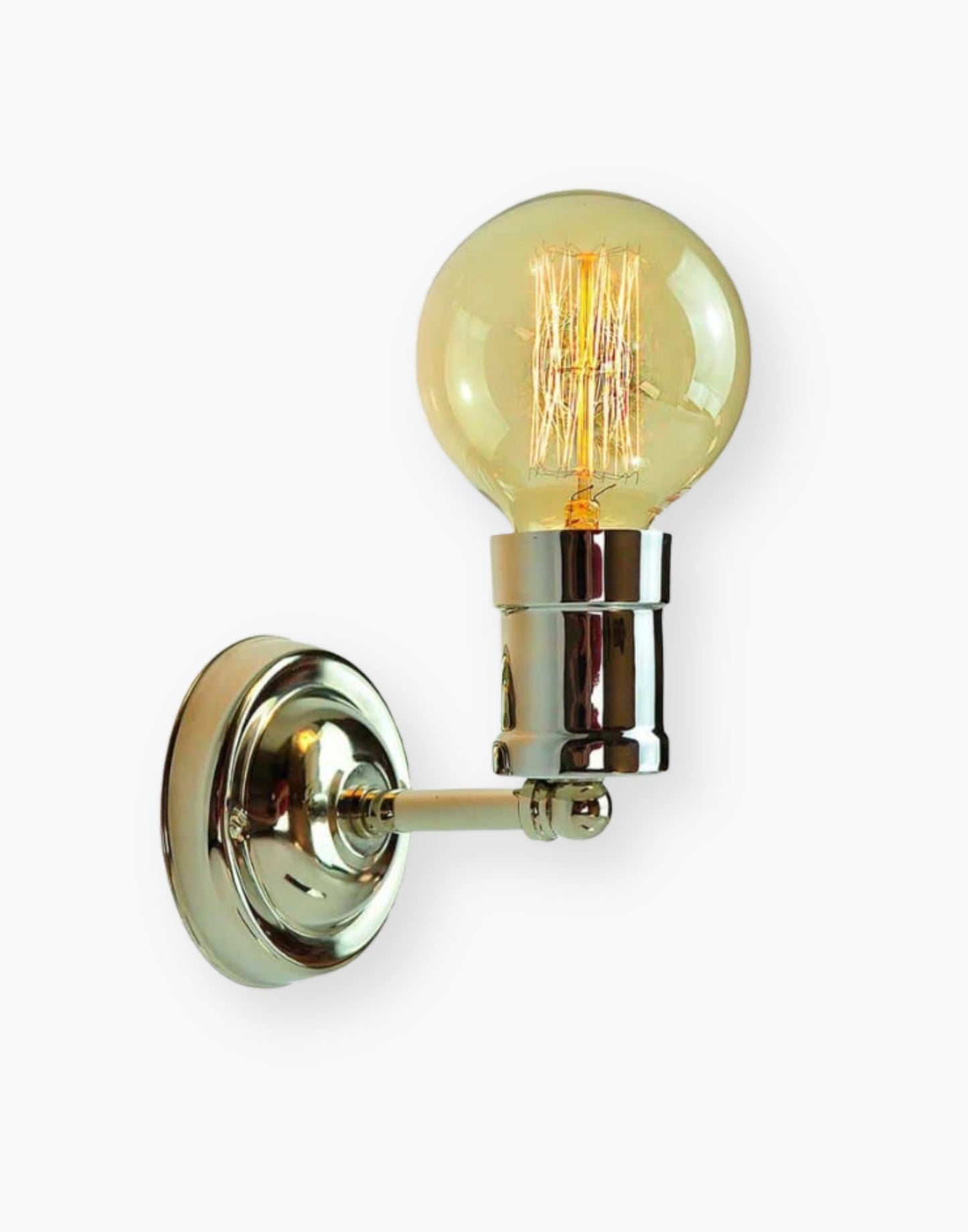 Fixed wall light in solid brass with exposed squirrel cage bulb, industrial World War One inspired wall sconce in antique brass or polished nickel.