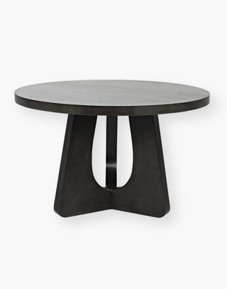 Dining Table has rounded edges with a black finish and a thick table top.