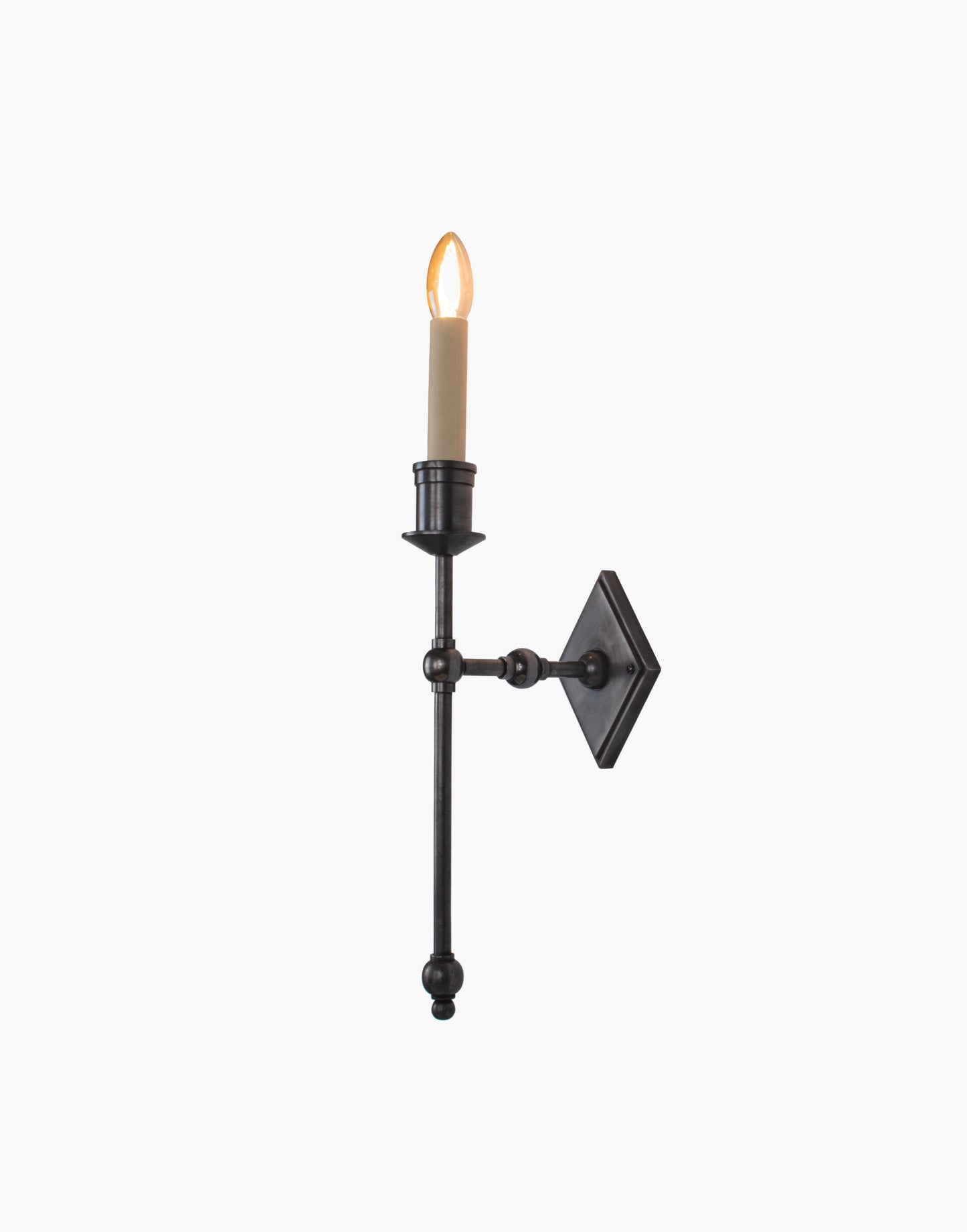 Wall sconce in cast and machined brass with diamond-shaped scalloped backplate and optional shade.