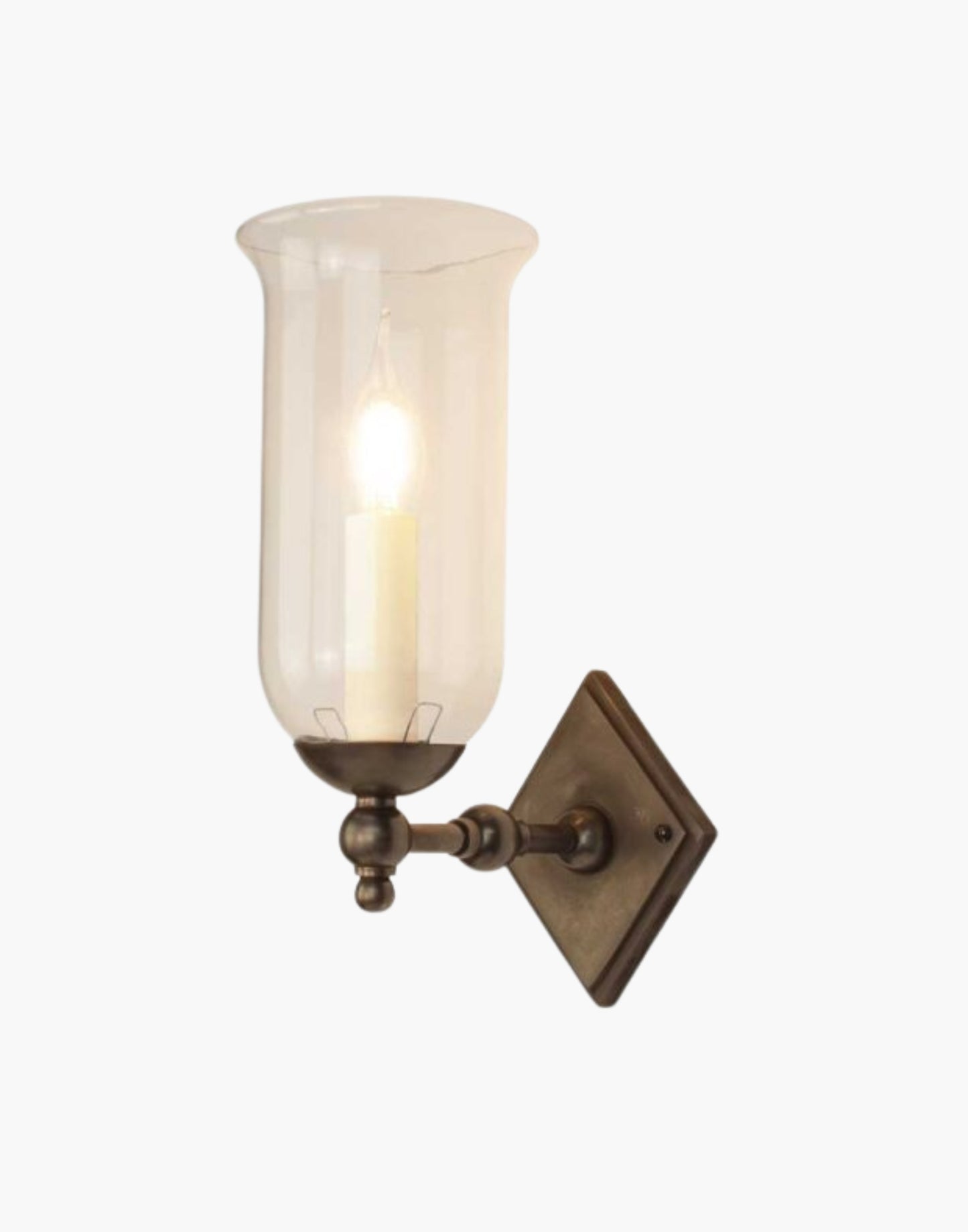 Christina Storm Glass Wall Sconce in solid brass with diamond-shaped backplate and scalloped edge. Rustic yet elegant, suits traditional and contemporary interiors.