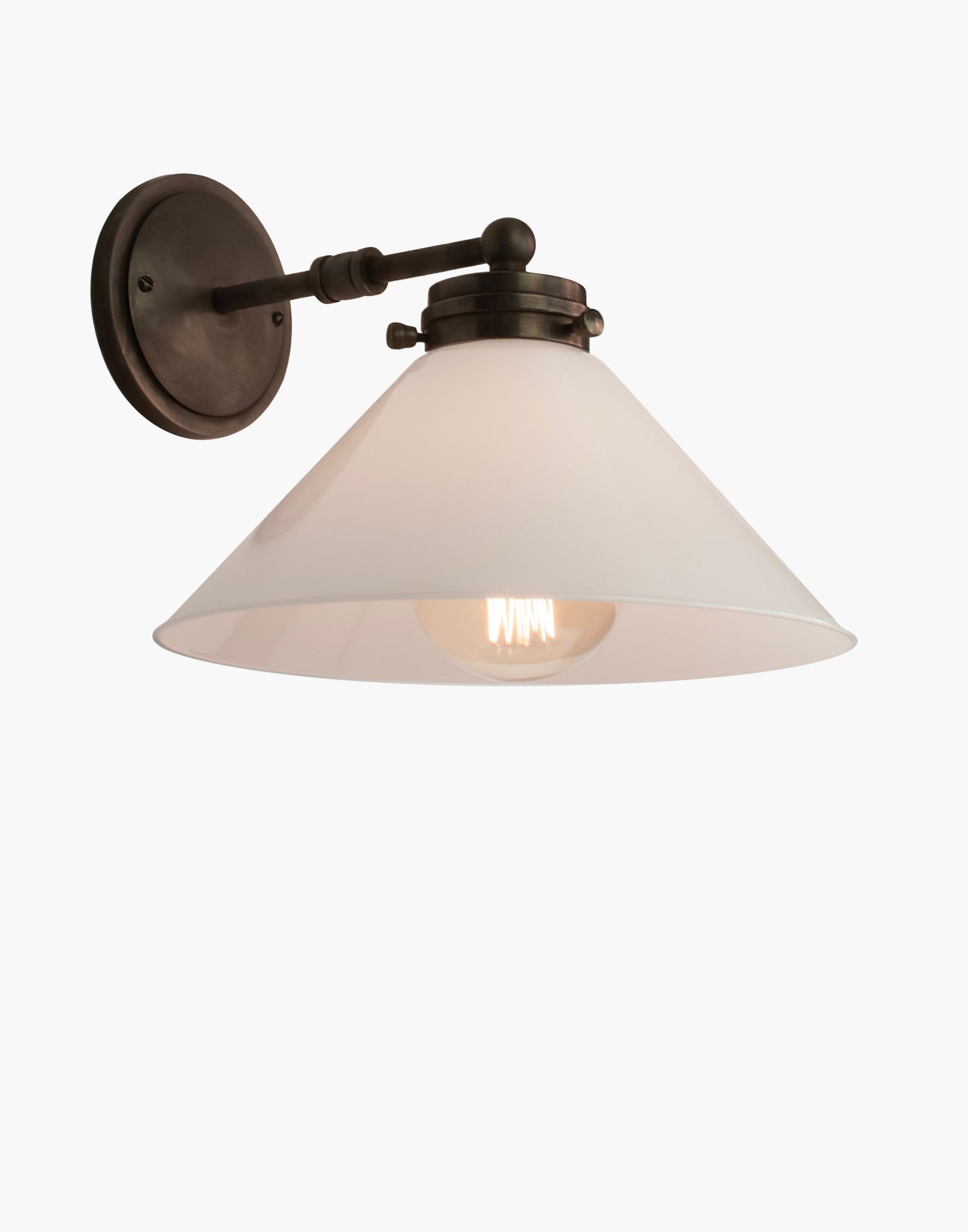 Wall light with solid brass construction, available with glass or brass shade, adjustable ambient or focused lighting for Victorian-inspired or contemporary interiors.