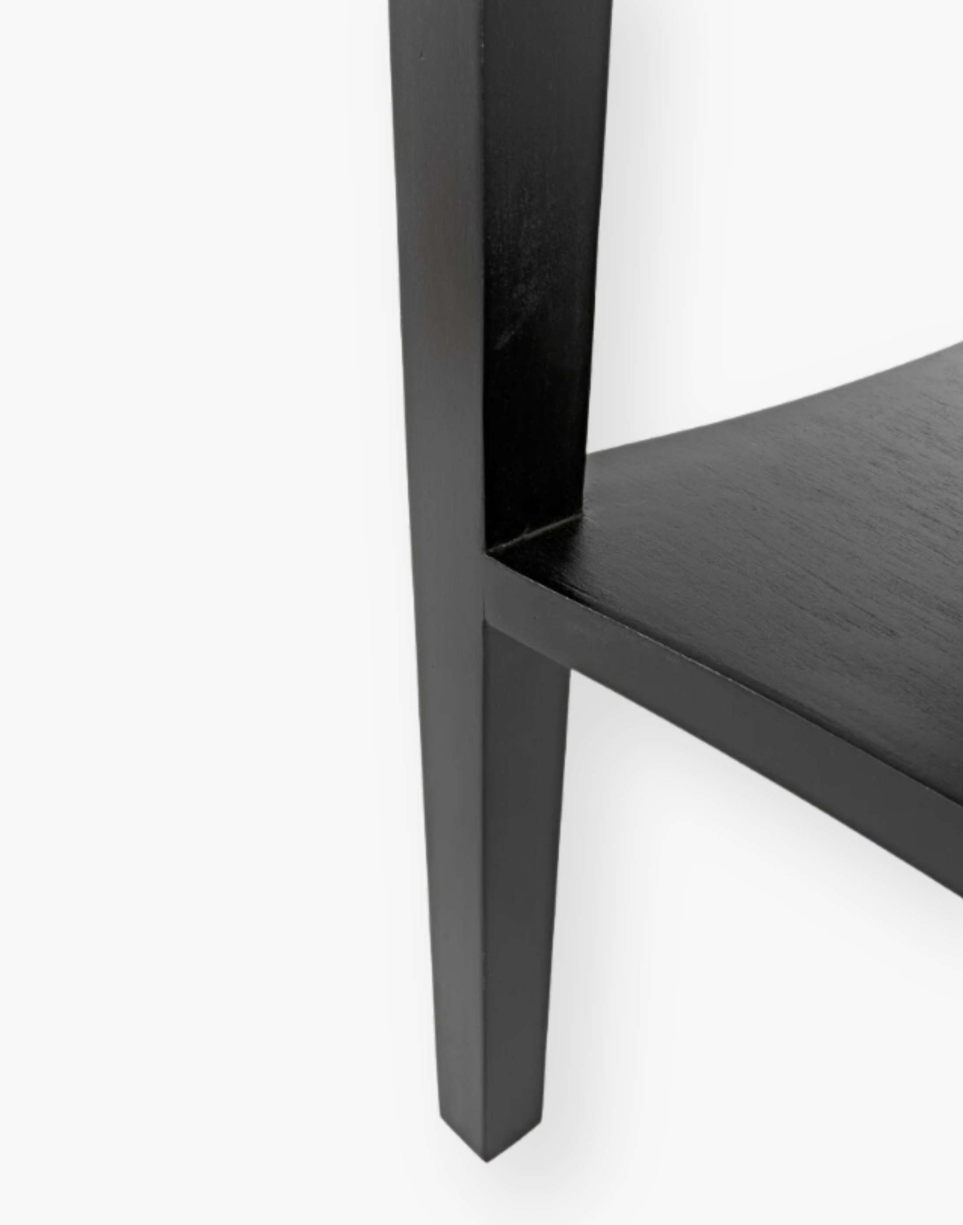 Weathered Black Solid mahogany side table with tapered legs and decorative carvings. Perfect for living rooms or bedrooms.