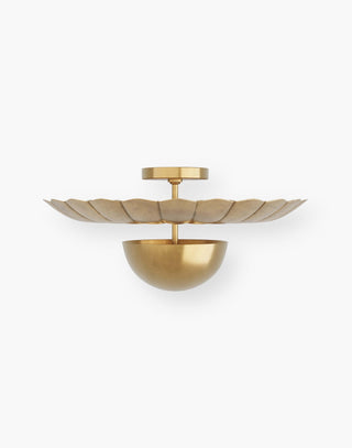 Antique Brass flush mount with a domed body that reflects light upwards, forged with seams to resemble petals.