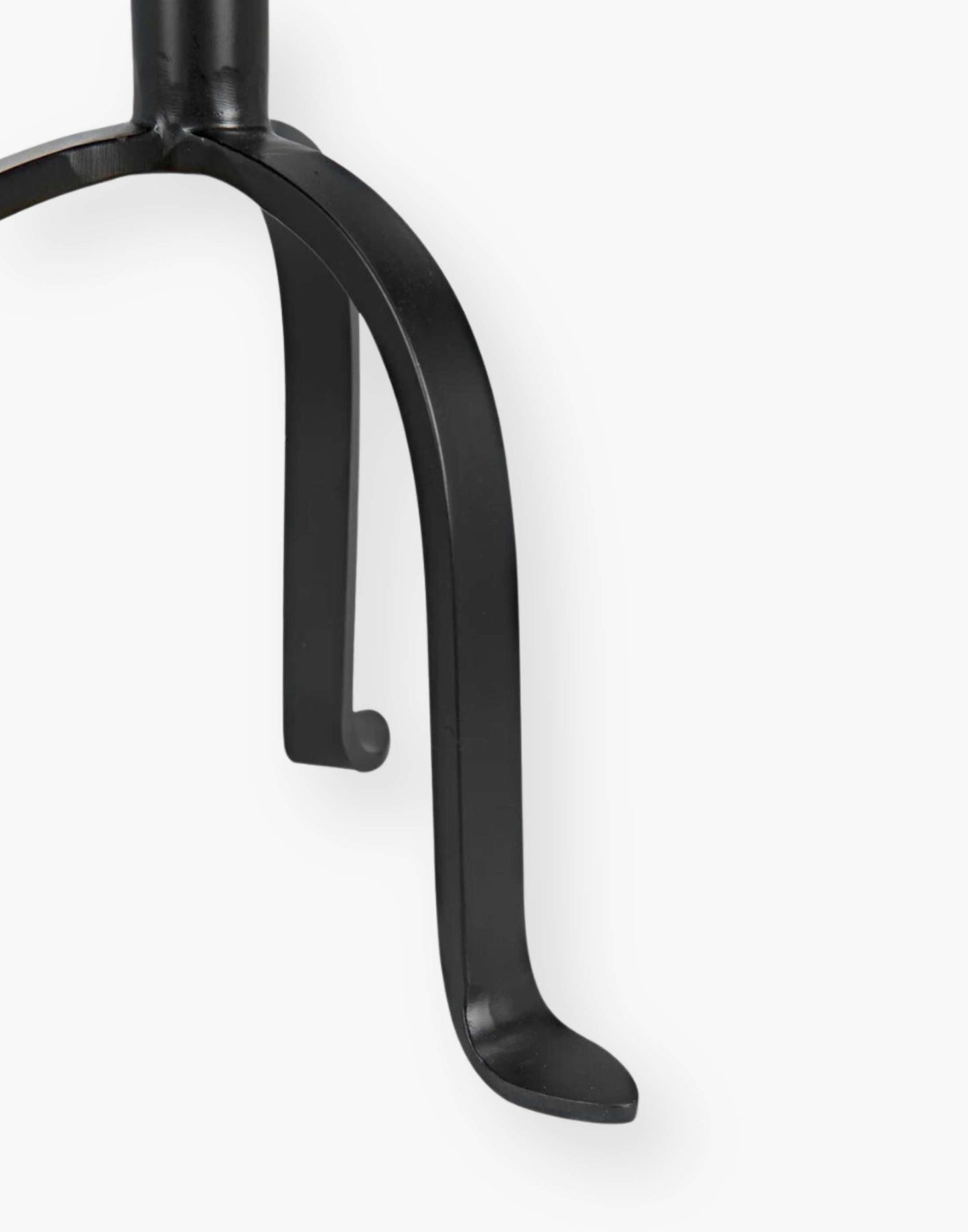 Victorian-inspired metal side table with rustic charm, perfect for small spaces. Adds flair to any room setting.