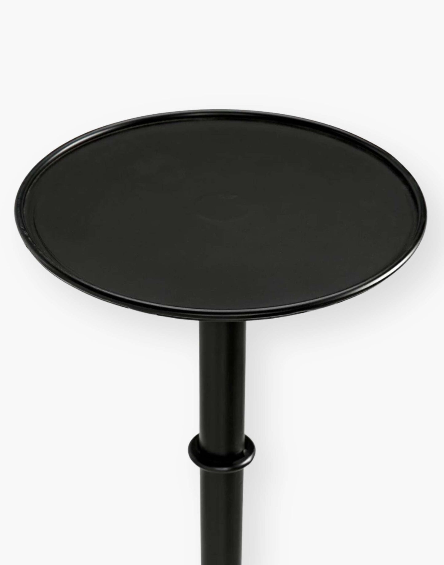 Victorian-inspired metal side table with rustic charm, perfect for small spaces. Adds flair to any room setting.