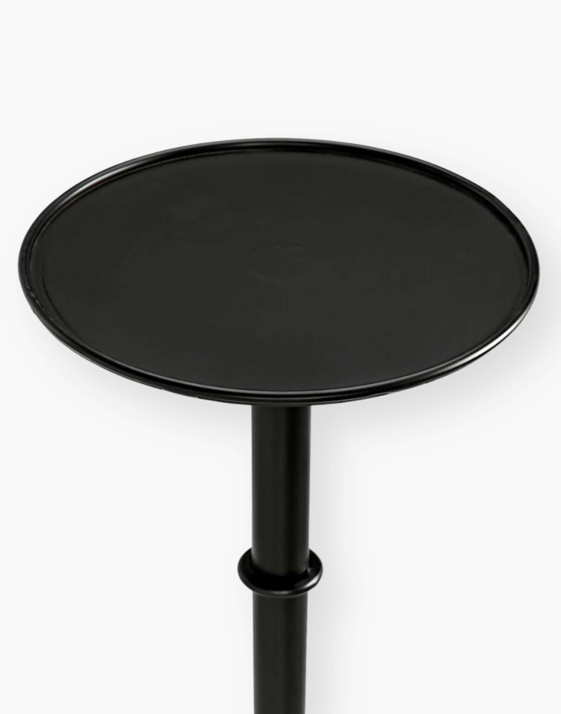 Victorian-inspired metal side table with rustic charm, perfect for small spaces. Adds flair to any room setting.