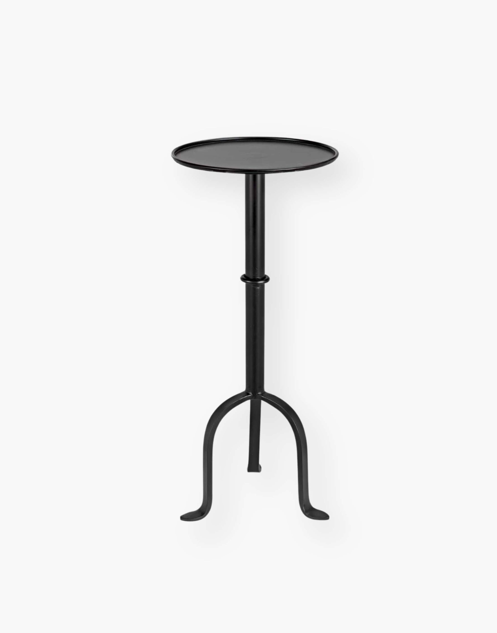 Victorian-inspired metal side table with rustic charm, perfect for small spaces. Adds flair to any room setting.