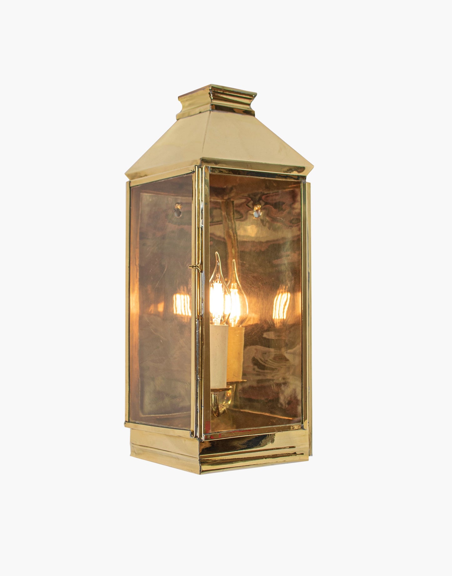 Wall Lantern in solid brass featuring a classic three sided French lantern design, wet rated for outdoor walls, porches, and entryways.