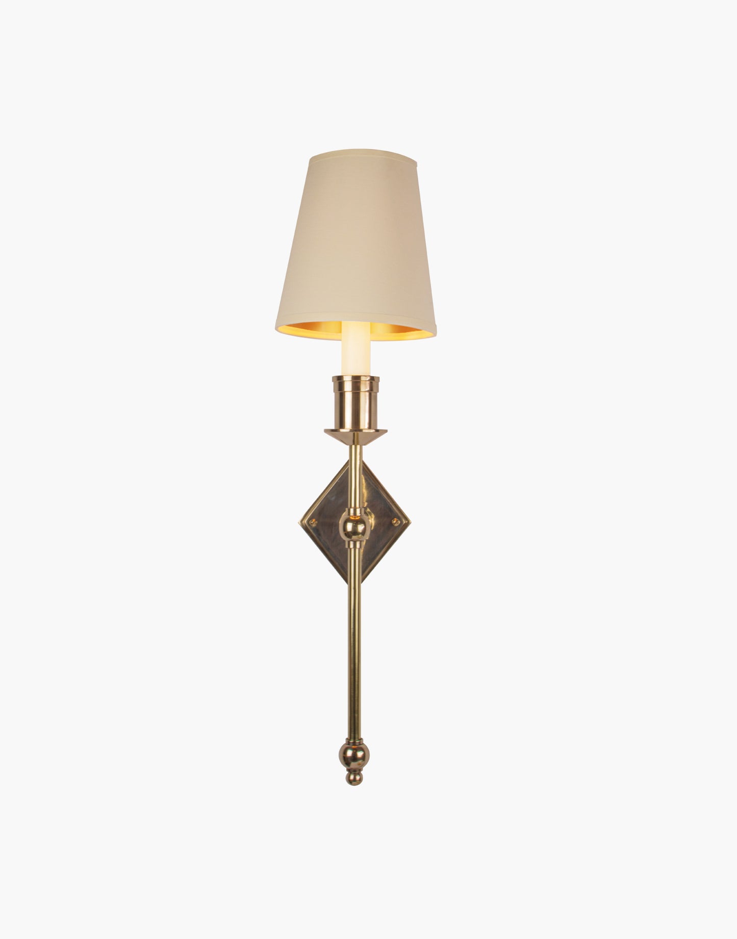 Wall sconce in cast and machined brass with diamond-shaped scalloped backplate and optional shade.