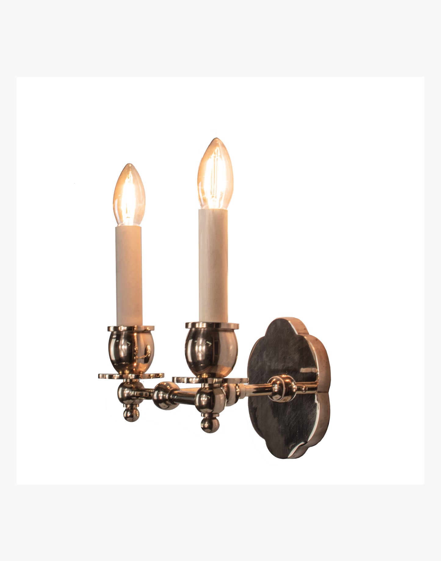 Twin Wall Sconce in solid brass with petal-shaped backplate and optional D6/D6G shades, transitional style for traditional and contemporary interiors.