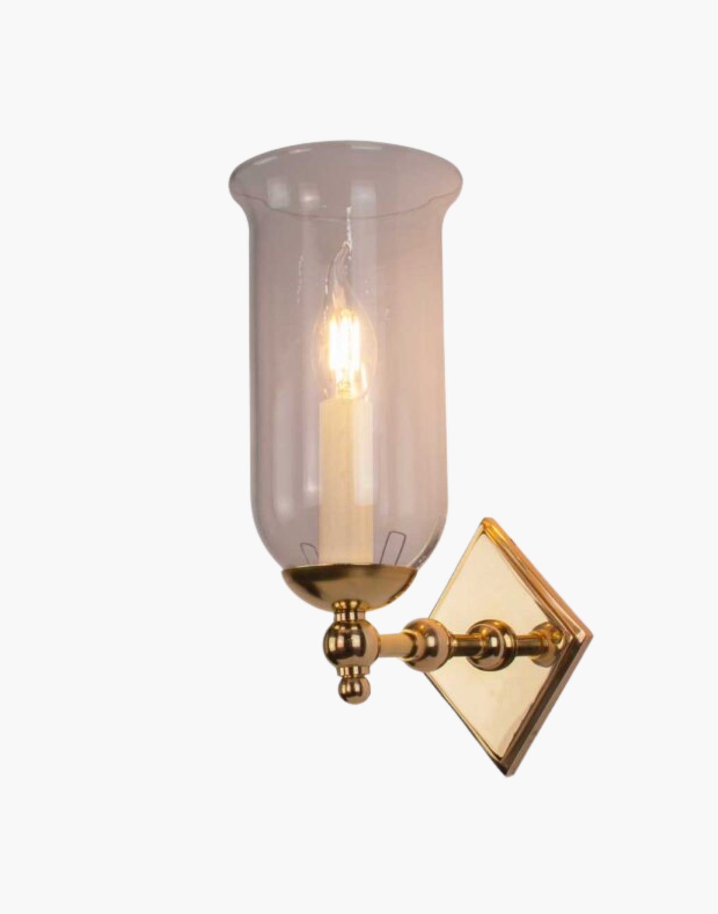 Christina Storm Glass Wall Sconce in solid brass with diamond-shaped backplate and scalloped edge. Rustic yet elegant, suits traditional and contemporary interiors.