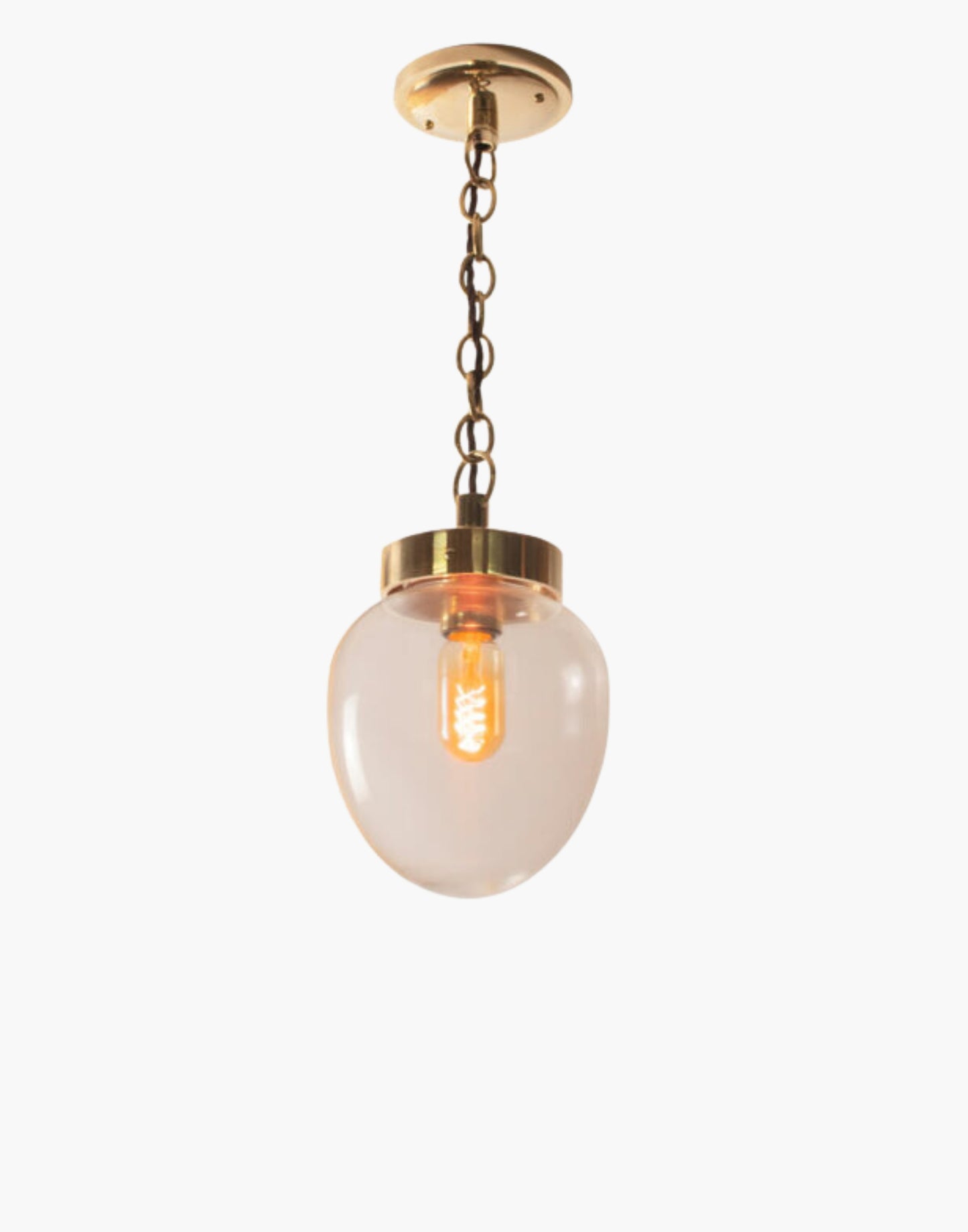The Charleston Pendant Light solid brass light with mid-century design, available in five finishes with clear or opal glass. IP44-rated flush version suitable for Zone 2 bathrooms. Hanging and flush options for covered outdoor areas.