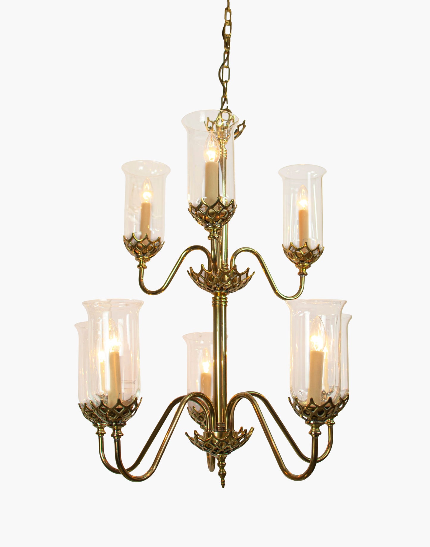 Eight arm chandelier in cast brass with clear storm glasses, statement period ceiling light inspired by an 1800 Irish church original.