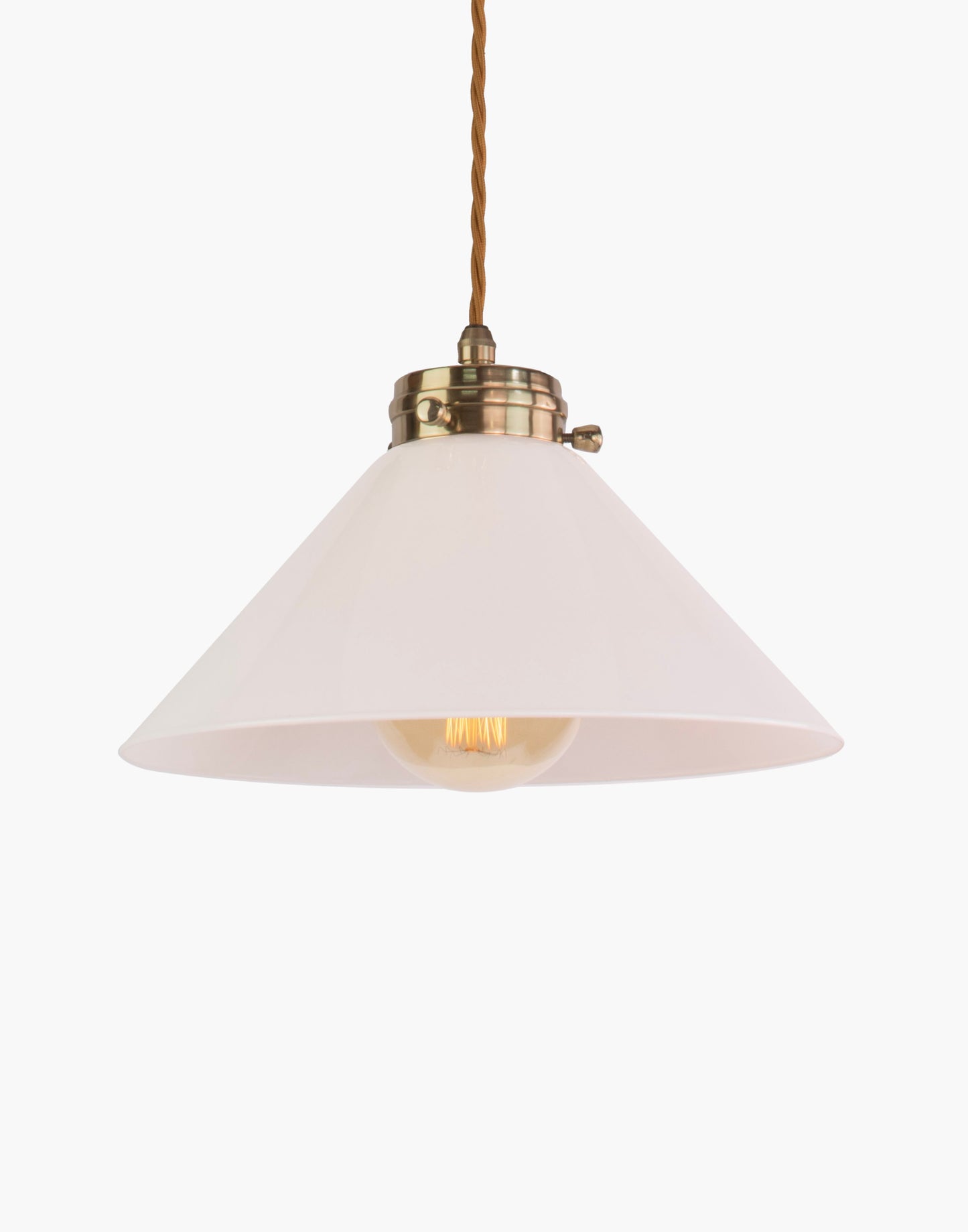 Pendant light in solid brass with classic silhouette, adjustable height, and refined transitional design for interior spaces
