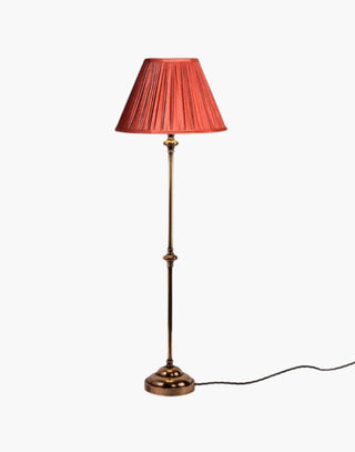 Distressed Finish with Coral Shade Provencal table lamps: simple, solid brass narrow lamps ideal for console or side tables.
