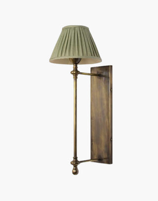 Distressed Finish with Green Pleated Shade Provencal wall lights: Elegant cast brass fixtures inspired by 19th-century French design. Customizable shades available.