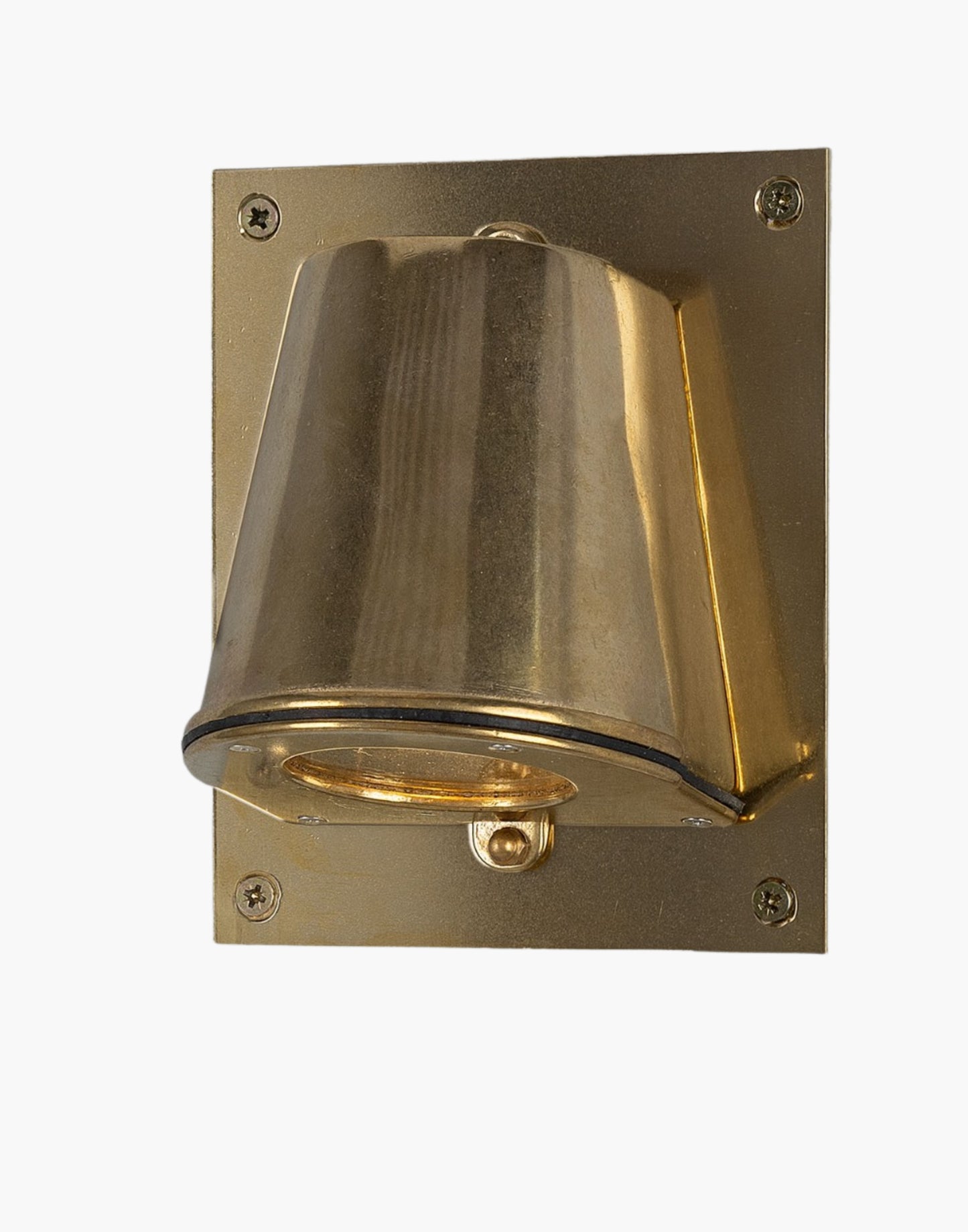 Outdoor brass wall spotlight with glass lens and compact rectangular back plate, IP54 rated, ADA compliant, designed for focused exterior lighting.