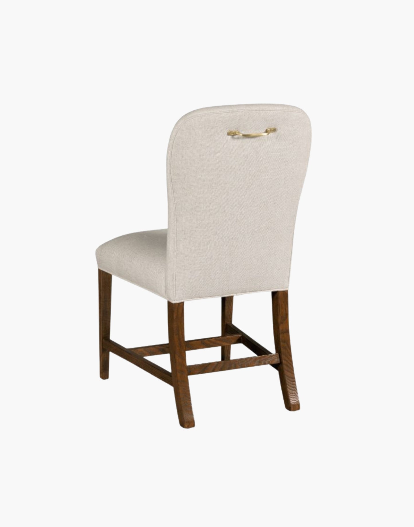 Fully upholstered gentle balloon shaped back resides over an upholstered seat with gracefully tapering legs.
